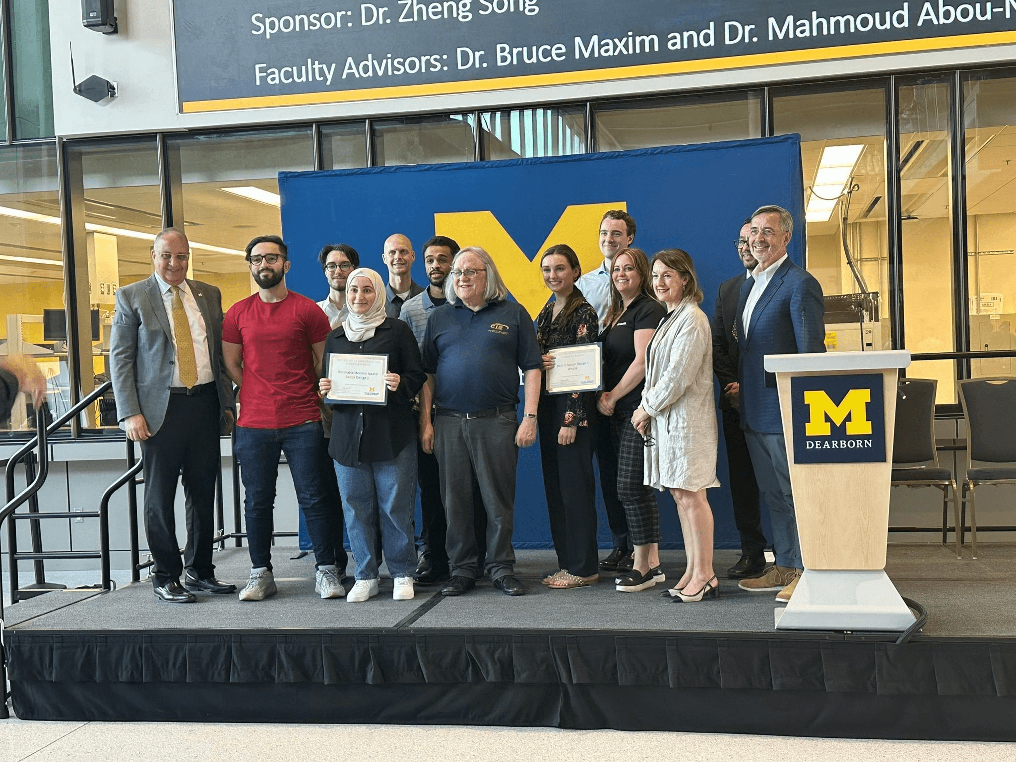 Receiving the Honorable Mention award at Senior Design Day 2023